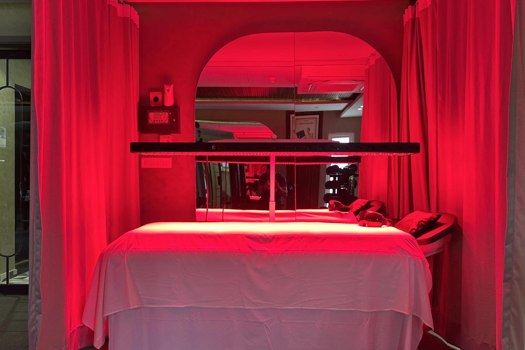 Red light room with its bed-style setup at the Delhi gym